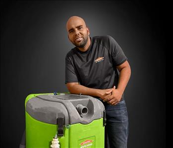 Eduardo Robles with green SERVPRO equipment