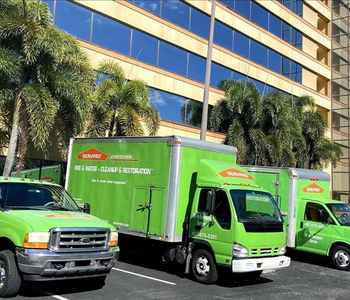 SERVPRO trucks parked in front of a hotel
