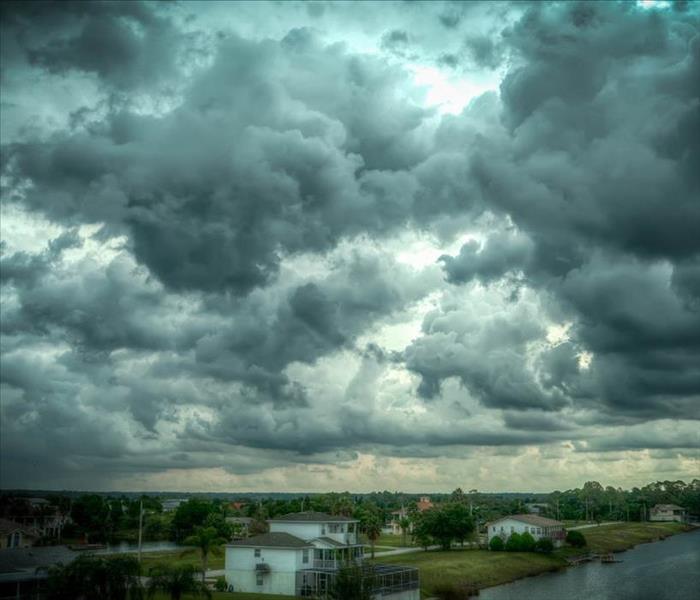 storm clouds above residential homes in central florida
